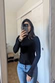 Hard to go wrong with a simple black turtleneck!  Not too thick, and will be good for layering for my trip to Europe this fall. I usually wear XS, so that's the size I purchased. The XS sits higher on the hips than I anticipated, which works really well with higher waisted jeans as long as I don't raise my arms straight up. The sleeves are a bit long but can easily be folded up. Overall, good product for the price. - Ariadni K.