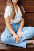 this worked out great with jeans as one of my senior picture outfits. i wanted the waistband part to fit snugly so I sized  down to an xs (usually in between xs/s), but if you want a somewhat loose fit as pictured on the model, go with your usual size! this was very soft and the front fabric did not fall open for me. a loose, airy vibe up top and i love how it comes together at the waist. so flattering! - Ashlyn M.