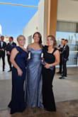 Dress is better in person if you can imagine that!! Material is great quality and hugs your curves perfectly.  Received many compliments.  I ordered both black and green and wore the black one.  Both are absolutely lovely.  Can't wait to wear the green one as well.  You can wear a regular bra if you wish. - Claudia P.