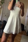 This is so cute but two things:
1. The top stretches out as you wear it. Halfway through my rehearsal dinner I realized if I bent over too far you could see me whole chest!!! I didn't have anything to change into! Probably better if you have a large chest but I'm a B cup. 
2. The skirt shrank when I washed it. The outer linen is now shorter than the under layer so it shows when you wear it and over all is just too short to wear now. I washed it in cold water and hung to dry. Probably needs to be dry cleaned :( - Nicole P.