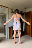 I didn't end up wearing it at the wedding because I went for a more formal option but I did bring this as a backup and I plan to keep it and wear it to another occasion this summer. I have super wide hips and am busy, despite being on the shorter side, and this dress fit me well. Super cute and simple with a nice lavender color. - Renee W.