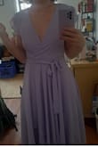I bought a size down (small) because I have a small chest. It was slightly too tight on the ribs but it loosened a bit with wear. I loved the way it hung and it's a well-made dress. I did briefly and unsuccessfully try to pin it to make it slightly less revealing when I bend down. I think this is something that is probably possible in the right hands. Also, the sleeves were perfect and didn't make me sweat all over the place. - Yona R.