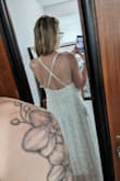 Got this for my elopement/microwedding in July. We will be outside at sunset at a lake and this dress fits that vibe. Make sure the back is sewn where the straps are on either side of the zipper and not under your armpit before cutting tags off 
It's really pretty and just needs some boob-cup support. Slit isn't that high. - Rebecca L.