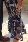 I received so many compliments in this dress. I bought a small and it fit perfectly including the length. The dress was well made. The only exception is that there is no padding so I had to use tape to hold up my breasts. - Debbie M.