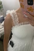 It's perfect for any bride-to-be!! I got a small because I was afraid the straps were going to be too big and it's perfect! I'm usually a size M. Does not stretch at the bottom, on the top it does a little! - Maddie N.