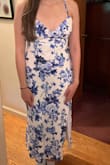 This is the most GORGEOUS dress I have ever owned! Recently, I've been between a medium and large with Lulus. I ultimately got a large so that I'd have room in my hips, and it was the perfect fit. The dress is a bit large in the chest, but the adjustable straps help tighten it up. The elastic gaped a lot in the back, but I used safety pins to take it in and now it fits soooo well. I wholeheartedly recommend this dress!!!!! - Regina R.