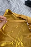 I initially ordered a medium, felt tight  so I exchanged it for a large and the replacement they sent me is sewed incorrectly so it's not adjustable in the straps included photo of a correct strap and the other faulty strap. Now I cant even wear this because it's not adjustable. - Britney U.