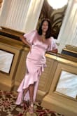 I'm glad a read the reviews to size up because I'm normally a medium in dresses. But I'm a little curvy (wide hips) and 3 months post partum (large breast) and this fit so well.  I purchased this for a wedding. I got a lot of compliments and danced all night. Great buy. - Dominique B.