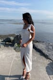 I did a last-minute courthouse wedding got this dress and OMG it fits so well. The material was thick and I love the delicate tie straps! I always struggle with straps since they are usually a bit too long for my 5'2 body so it was great that these "tie to size". The thigh slit also gave it a touch of sexiness. I got so many compliments on this dress! 10/10 - Christine V.
