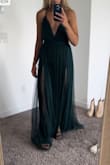 This dress is stunning. I'm in between sizing of a medium and a small. The small fit my bust a lot better and my figure. It's a hair tight around my runs but worth it. 

-runs a little long, if you have time I would try to hem it. 
-green goodness status.
-the right is a medium and left is the small. - Alyssa H.