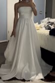 Looks just like the pictures! And fit me perfectly and great quality! Only thing is the sew lining on the top of my chest. It's a little scrunched together but overall not bad for the price of this dress. - Oanh T.