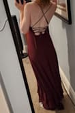 I got this dress for a wedding in early fall. The fit was just about perfect, and I'm in love with the color!!
The fabric hangs beautifully and the skirt flows and waves around when you walk or twirl, it's a dream. I feel so elegant in this dress, and it's WAY more comfy than I would have thought!
I usually get frustrated with tie-up-backs like this one, but I could get it tied and set my myself without any help. Honestly, I'd recommend it for that alone! - Katie C.