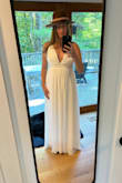This dress was absolutely perfect for our small, laid-back backyard wedding! I loved having the adjustable straps and my chest felt completely secure with the right amount of cleavage I wanted exposed. The cups have enough lining that I didn't require a bra & a big plus for me! The empire waist flattered my apple shape and with heels the length was good. I did step on my dress a little bit but was able to walk down the aisle just fine. I felt like a goddess in this dress and it paired beautifully with my hat! - Jaime R.