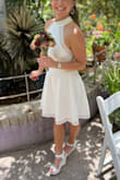 After years of trying to plan a wedding, we decided to elope! Since we live in southern Arizona and our little ceremony was in mid-June with regular temps in the 100s, I wanted something that would allow my body to breathe (and sweat) without causing too much discomfort. When the dress arrived, I was surprised at the quality of the material and just how nice it was. Everything about the dress fit perfectly, which is not something I get to experience often!
One thing worth noting is that this is not a pure white; it's more ivory or off-white in color.
At 4'11", I'm quite petite and my build is a combination of slender and athletic. The material was really beautiful and flattering, and to avoid wearing a bra I chose to wear some Nippies nip covers and they worked out great. No fussing with a bra and everything looked seamless.
This dress can be with again for any other type of celebration or vacation, but I love that I wore it to get married to my best friend. - Lynn B.