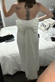 This dress is my dream- it has all of the things I was looking for for my bridal shower. The bow, the length, strapless, and the material is great (stretchy, soft.) However, this dress is SO heavy! I tried it on and was uncomfortable just walking around the house. It felt like it was being pulled down on me. The bow is detachable and that helps with some of the weight, but the dress itself is heavy too. I love this dress, I just was not comfortable feeling like it was weighing me down, so I had to return. - Kelsey S.