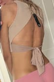 The top is not bad, but would be better if it was a ticker or double layered material. The nipples are slightly visible under good light. Also you need to tie it tight for it to fit perfectly well. - Barbara K.