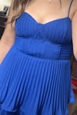 Wore it out for a "glam" night birthday celebration. I loved the layers, reminds me of a cupcake. Fit comfortably, but the material in the middle bunches as if it's too small. I wore a medium but tried a large and it didn't make a difference with the bunching. Still loved it. - Brittany M.