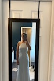 Not a huge fan of the bust in the front on myself personally but the back is great it's a beautiful dress - Ashley M.