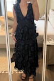 This dress is so comfortable but also so elegant! The fit is slightly large (but I don't mind) I'm typically a medium and this gives a little room and doesn't feel tight at all. I may need to add a few stitches in the chest area to make it less low cut. It really is a beautiful dress and I can't wait to wear it! - Erika J.