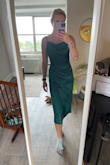 The fit in the stomach with the ruching isn't very flattering. Don't know how I feel about this dress or if I will wear it. It's a lot of material on the stomach. - Emma M.