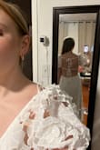 This dress is absolutely INCREDIBLE! It runs big so I would recommend going down a size (which is what I ended up doing), but it's absolutely gorgeous and looks/feels very high quality. It has really unique 3D floral accents, and it also has the perfect amount of plunge; the back straps give a surprising amount of support, and I didn't need to wear a bra or sticky tape with this because of how secure the back was. I bought this for my engagement party and loved it so much I'm going to wear it for my bridal shower too. I highly, highly recommend! - Molly G.