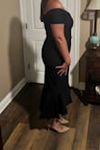 The fabric is stretchy and thick (in a good way). No zippers or snaps - all one piece. It looks beautiful in person. - Kristin J.