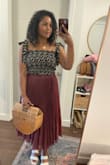 Love this top! The tie sleeves are the perfect details. Goes well with jeans or a skirt! I only gave 4 stars due to the sleeves coming untied or loosening randomly. Just need to keep an eye on them lol but otherwise great! - Joelle H.