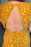 I really loved this Dress! There is some gapping on the open back, but over all it fits super well and is very cute and summery. The loop for the button on the back broke the first time I put the dress on, but I was able to resew it and it held after that. - Caroline W.