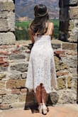 So very happy with this purchase!  I was surprised at how well it fit.  You can adjust the straps to make it fit a little higher or lower.  The material is great quality, lace with a little fringe at the bottom and nude lining underneath.  The nude lining is shorter than the dress ends at the mid-thigh area. - Nina S.