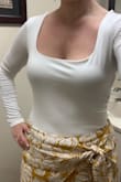 Great bodysuit! I love that the body of it is double-lined so it's not see-through at all but it's not so thick that I get too warm. The sleeves are long enough, the fabric is super soft and it fits true to size. - Lola C.
