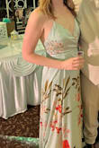 I love this dress so much. Though I've never before had an issue with a dress being too long haha. I failed to get it tailored before a wedding and used the sticky hem thing and I would not recommend that haha. There's a couple layers up in there. I made it look like a balloon at the bottom, but I still got compliments! I'm going to get it professionally hemmed so I can wear it again and do it some justice. - Arielle K.
