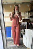 I loved this jumpsuit! I wore it for a brunch for my birthday and it was perfect. I am tall and the length still went to the floor with heels on. I wanted it to be a little looser/more flowy with this fabric so I sized up to an XL, but if you want it to be more form fitting, pick your usual size! I got multiple compliments on it. Made very well and looks as pictured! The color is gorgeous and the asymmetrical straps are such a unique touch. Highly recommend. - Lauren S.