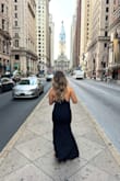 I tried on a lot of dresses and this was the one that flattered my body the most. The fabric is thick but I didn't feel warm. The dress was highly praised and is my favorite. - Giovanna B.