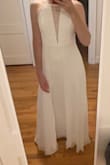 First, let me say I LOVE this dress. The lace detail on bodice/neckline and peekaboo back are very flattering and the material falls around your waist and hips so elegantly. I do wish there were a few more sizing options besides S M L. I first ordered the medium and it felt too big, especially in the bust and waist. Then ordered the small but it was a tad too tight on my ribs and the keyhole back was straining open a bit instead of laying in its natural position. I ended up returning the small and keeping the medium and I had the top taken in an inch or two on the sides. For reference, I normally wear a small top and a medium bottom. - Anna L.