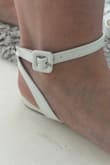 I wish I would've read the reviews before purchasing these. The front toe strap was too tight and dug into my skin after wearing them for only a couple minutes around the house. The back heel strap is too loose and can't be adjusted so they flip around every time you walk. They're too small and too large at the same time which wasn't an option to select in the review. The straps are also shiny (plastic looking) and the buckle is made of plastic which made them look cheap. I returned them. - Ashley H.