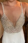 This is such a gorgeous and detailed dress. I always envisioned myself wearing a lace wedding dress, but this dress easily changed my mind. The detailing in the beading is amazing. It looks even better in person. I am obsessed and cannot wait for my wedding! - Ashley B.