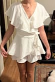 This is so flattering and flirty. Looks great on and fits true to size. I'm wearing it to my bridal shower coming up! Needs ironing, but it's beautiful! - Hannah H.