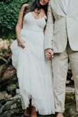 I wore this for my elopement. I was traveling up until the week before my wedding and honestly bought this as a back up in case I couldn't find something when I came to town but ended up loving it much more than expected! It was perfect for the occasion and I'm going to get it cropped above the knee for our party with family and friends on our 1 year and wear it again! The fit wasn't as snug around the bust as I'd like but that's clear in the model's photos too and I still felt beautiful in it. - Abigail O.