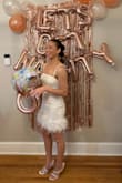 Wore this dress for my bachelorette. It does fit a little tight and the feather material is delicate so I was nervous about pulling it off the dress, but it ended up being fine.
I loved the way it looked though and I got a lot of compliments on it! - Sierra H.