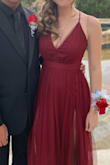 Bought this dress for my daughter's event, and she was stunning!! She was 15, so the slit was higher than expected (but fine - it's covered by the sheer layers), and she needed pretty high heels because it's long. She looked and felt elegant and beautiful!
It's also pretty LOW cut, so I sewed the front together about 2-2.5", and it was STILL low cut!! But it was fine. --You can tell I sewed it together real quick. :) She looked and felt amazing.
Absolutely one of the best gowns and incredible price for the quality. - Jill O.