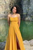 This dress was super beautiful and I received so many compliments. It was bit snug around the torso, but I wouldn't have wanted a different size. Due to that though and the wedding being outside in the summer I experienced some sweat spots that weren't very desirable but dried fairly quickly. They showed up in a few of my photos. If you're shorter like myself definitely plan time after you receive it to have it hemmed. I wore 4 inch platform heels and still needed about 4/5 inches to come off which you can also see. The split is higher than it appears especially if you have a longer torso like myself , so be prepared to keep an eye on it lol. All in all love it, it will be a staple dress for me once I get it hemmed. - Amira M.