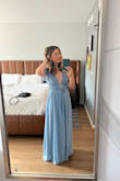 I'm short so I needed to get it altered. I wore this at a humid wedding and survived the heat. I could easily dance in it. I'm typically a size S but after reading the reviews I decided to get an XS and it fit perfectly! I recommend double-sided fabric/ body tape to keep the straps up. - Diane M.