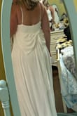 I read the reviews and ordered the larger size. Medium would not have fit. This did fit beautifully but I would've had to remove some of the length for a beach wedding. This dress surprised me it was more elegant and beautiful in person. I didn't choose this dress but it was definitely in the top 3. - Heather L.