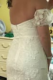 I sized up to Large based on reviews. The dress fits absolutely perfect! The length, waist, hips and bust were a perfect fit. I'm a medium size 8 in most clothes. Wearing flats for a beach wedding dress doesn't need any alterations can wear right out of the box. Elastic in sleeves is comfortable as well. Waiting on a few other dresses to decide but this is definitely a contender. - Heather L.