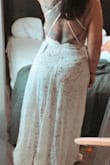 I love it I wish I would have bought a dress like this for my wedding instead of spending so much money on mine. Good quality well made (hella see through) but has a nice body suit under. I wish the straps were adjustable but love it so much. Can't wait to take my anniversary photos in it. - Morgan B.