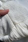 This dress is adorable and perfect for my bridal shower. I tried it on, fell in love, and then i looked at it again a week later and i noticed make up stains. it was the last one in stock so i'm extremely disappointed. i love it and can deal with the stain but there should have absolutely been some sort of discount for a few brown stains on a white dress. just disappointed - Rachel H.
