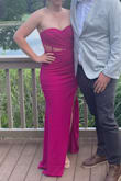 This dress is perfection. It's stretchy and incredibly flattering. I've gained some weight over the past few years and was a little worried about the tightness of the dress when I am a size larger than I usually am but it still looked amazing. I got so many compliments. I didn't even wear shapewear, it actually looked better without it. For some reason I expected the dress to be more pink, but it definitely has purple in it. I've included two pictures to show.
The only two slight comments I have are that it ran a little long (I probably should've gotten it hemmed but didn't have time) and if you wear a bra with it, your bra cup will show through the mesh if you pull the dress up too high.
Anyway, I LOVE this dress. Highly recommend. - Grace O.