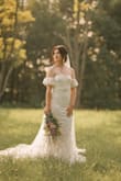 I wore this dress for my wedding and it was perfect! The quality and fit are amazing- snug in the right places and it didn't fall down in the chest, the train was long and dreamy, but easy to manage. The material under the outside layer was stretchy and comfortable. Could not love this dress more- highly recommend it. - Carly P.