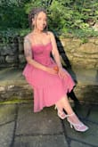 This dress is beautiful and the fabric is to die for. It's light and airy. Perfect for a summer event. I wore it to a wedding and received so many compliments. I'm more on the curvy side so I was scared it would make me look like a box, but it really accentuated my figure. If you're on the busty side you may have issues with spillage in the bustier. - Antwanisha S.