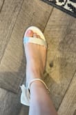 Purchased these as potential wedding and/or bridal shower/engagement photo shoes. I'm a pretty true 9.5 but do own some 10s. My feet are somewhat narrow with pretty flat arches and pretty skinny ankles. Since Lulus doesn't make 9.5, I ordered a 10. They seem about half a size too big (surprise, I know). Most notably, the part over the toes was too high, and the ankle strap was way too big, though I probably could've added extra holes. They might've fit decently if I could size down a half size, though the ankle strap would still be too big. I can't speak to durability or comfort, but they're really cute! Just too big. Sadly I'll have to return them. - Laura H.